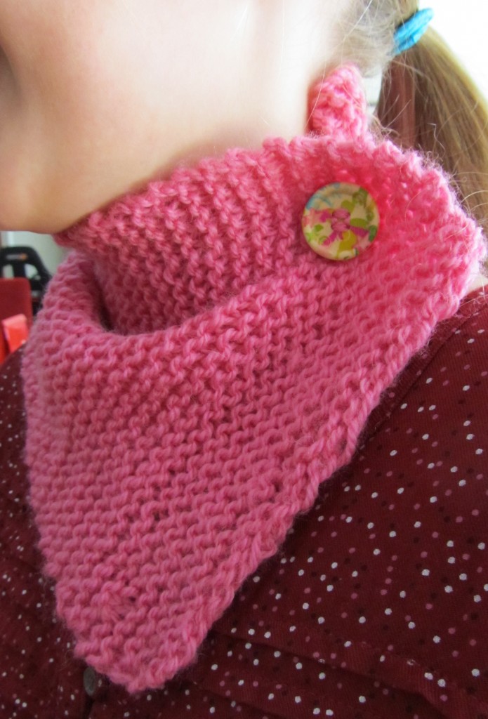 The neck warmer with button worn to the side.